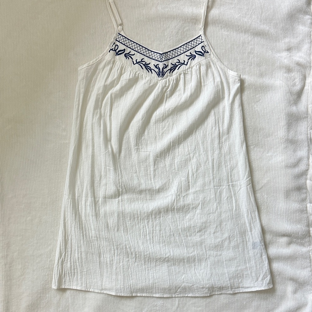 casual white dress with blue embroidery detail